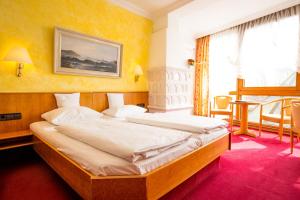Postel nebo postele na pokoji v ubytování AAAA Hotelwelt KÜBLER