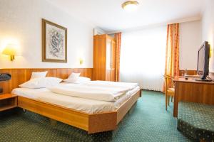 Postel nebo postele na pokoji v ubytování AAAA Hotelwelt KÜBLER