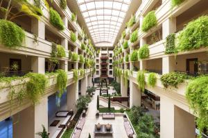 arium of a building with plants on the ceilings at Puerto Antilla Grand Hotel in Islantilla