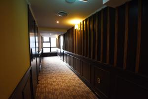 an empty hallway with a hallway light on the ceiling at 57 Myeongdong Hostel in Seoul