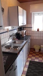 Kuchyň nebo kuchyňský kout v ubytování Ferienhaus Krähmer + 37 fotografií