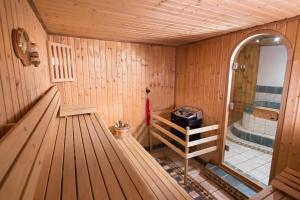 an inside view of a sauna with a tub at Au Coeur Des Alpes in Villarodin-Bourget