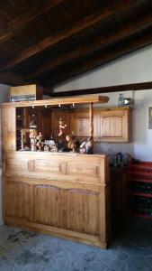 a kitchen with a large wooden counter top at Craii Neamtului in Almaş