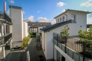 a view of an alley between two buildings at Ferienapartments Am Steinfelder Hof in Bad Neuenahr-Ahrweiler