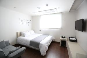 TV a/nebo společenská místnost v ubytování Residence Mumum Hotel