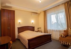 เตียงในห้องที่ Domik v Samare Hotel