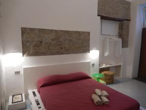 A bed or beds in a room at Sant'Alfonso Maria De Liguori Rooms