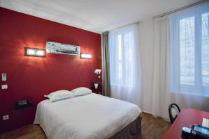 Postel nebo postele na pokoji v ubytování Occitania Centre Toulouse Matabiau + 19 fotografií