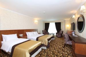Postel nebo postele na pokoji v ubytování Arya Hotel Sakarya