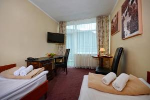 Posteľ alebo postele v izbe v ubytovaní Mazowsze Medi Spa + 37 fotografií