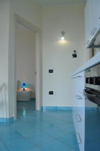Kuchyň nebo kuchyňský kout v ubytování Residence Tre Palme