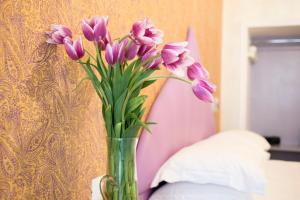 Postel nebo postele na pokoji v ubytování Ripetta Rooms