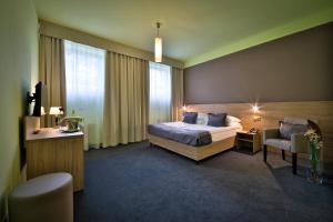 Postel nebo postele na pokoji v ubytování Atlantic Hotel