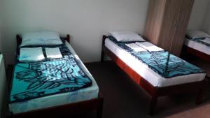 Letto o letti in una camera di Mico NP Guest House