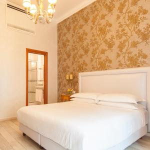 Postel nebo postele na pokoji v ubytování Ripetta Rooms