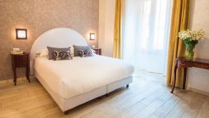 Postel nebo postele na pokoji v ubytování Ripetta Rooms