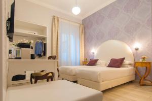Postel nebo postele na pokoji v ubytování Ripetta Rooms