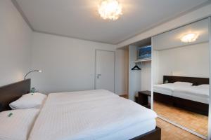 Säng eller sängar i ett rum på Gasthaus zum Bahnhof