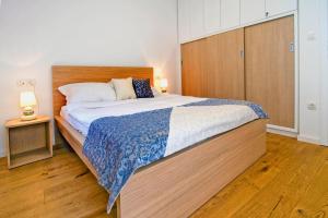 Posteľ alebo postele v izbe v ubytovaní Apartment Danalu
