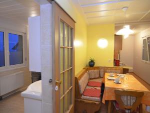 a living room with a table and a dining room at Holiday home in Wernigerode with private garden in Wernigerode