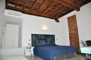 A bed or beds in a room at Cibele Bed&Breakfast