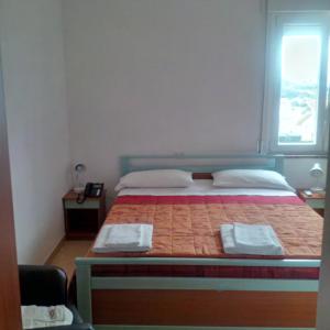 Voodi või voodid majutusasutuse Hotel Maremonti toas