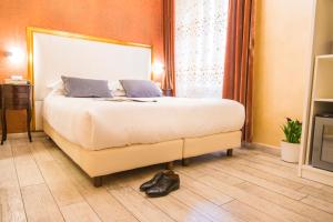 Postel nebo postele na pokoji v ubytování Ripetta Rooms