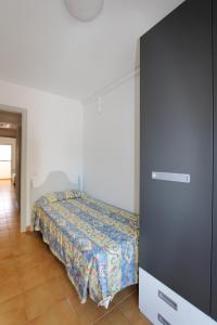 a bedroom with a bed and a dresser at Residencial Super Stop Palafrugell in Palafrugell