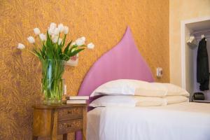 Postel nebo postele na pokoji v ubytování Ripetta Rooms