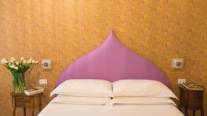 Postel nebo postele na pokoji v ubytování Ripetta Rooms