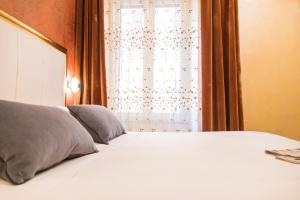 Postel nebo postele na pokoji v ubytování Ripetta Rooms