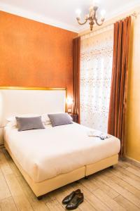 Postel nebo postele na pokoji v ubytování Ripetta Rooms