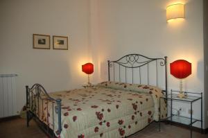 Posteľ alebo postele v izbe v ubytovaní Residenza Torre Acquatino + 24 fotografií