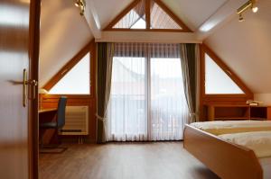 Postel nebo postele na pokoji v ubytování Hotel Garni Bergblick