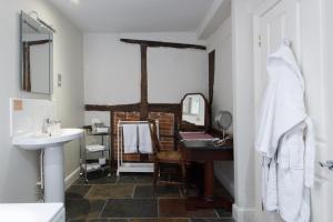 a bathroom with a sink and a mirror at The Old Vine in Winchester