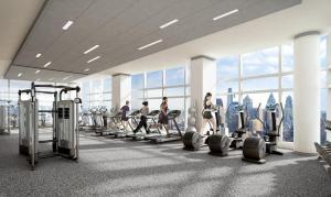 a gym with people exercising on tread machines in a building at AKA University City in Philadelphia