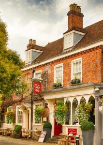 a red brick building with a cafe sign in front of it at The Old Vine in Winchester