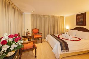 Voodi või voodid majutusasutuse Hotel Agustos Cusco toas