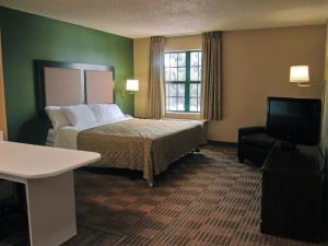 A bed or beds in a room at Extended Stay America Suites - Toledo - Holland
