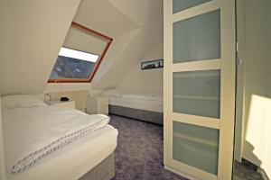 A bed or beds in a room at Haus Sabina