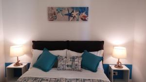 Postel nebo postele na pokoji v ubytování B&B Il Saraceno
