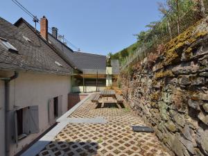 a stone wall with a row of benches on it at Apartment in Zell near Mosel River & Vineyards in Zell an der Mosel