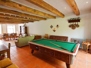 a living room with a pool table in it at Inviting Holiday Home in Beauraing with Garden Terrace BBQ in Honnay