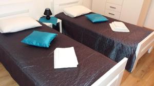 Postel nebo postele na pokoji v ubytování Apartmani Luan