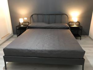 A bed or beds in a room at Sensation House