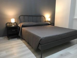 A bed or beds in a room at Sensation House