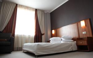 Posteľ alebo postele v izbe v ubytovaní Hotel Praha