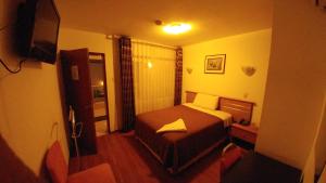 Postel nebo postele na pokoji v ubytování Libertad Hotel