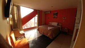 Postel nebo postele na pokoji v ubytování Libertad Hotel