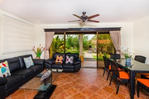 a living room with a couch and a table at Coco Sunset Hills #52 in Coco